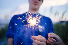 teen with sparkler
